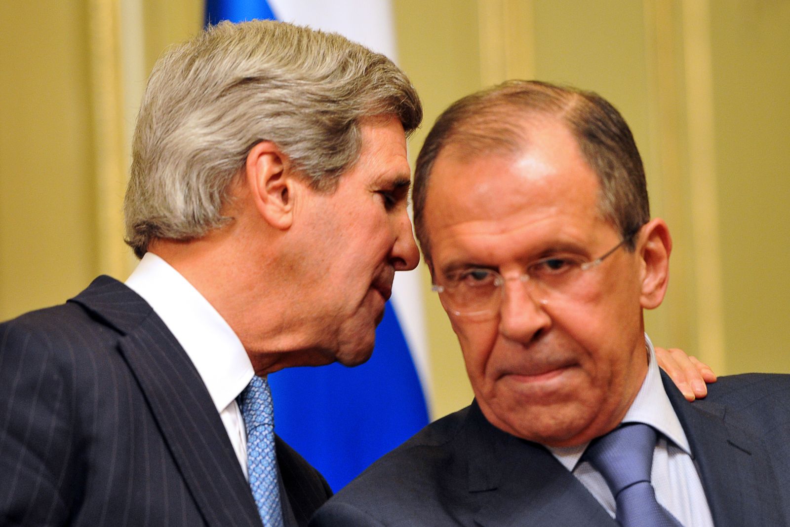 us-secretary-of-state-john-kerry-whispers-to-his-russian-counterpart-sergei-lavrov