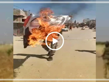 شاهد إحراق المتظاهرين لصورة اردوغان ضمن مظاهرات باب الهوى شمال ادلب