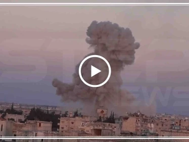 بالفيديو|| لحظة سقوط برميل متفجر من مروحية للنظام السوري على المنازل بمعرة النعمان!