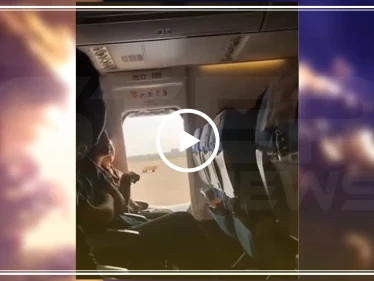 شاهد ما حدث لامرأة حاولت فتح مخرج طوارئ الطائرة أثناء قلاعها (فيديو)