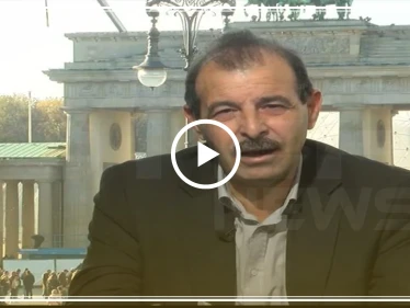 بالفيديو|| محامٍ سوري يكشف عن أسماء "مجرمين" باللجنة الدستورية، بينهم قيادي بالمعارضة