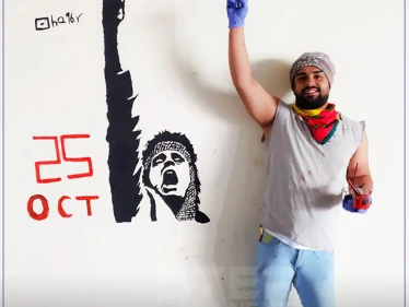 رسم على الجدار لـ "عبد الباسط الساروت" في العراق