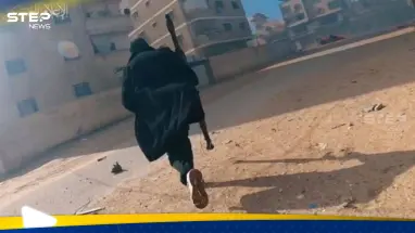 شاهد|| "بالطو القسام".. أناقة مقاتل فلسطيني في غزة تثير تفاعلاً بين النشطاء