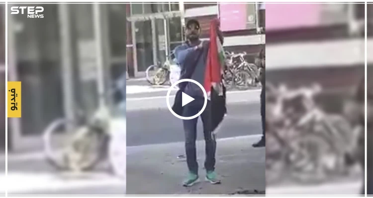 سجال حاد بين مؤيد للنظام السوري ومعارض يحرق علم النظام أمام السفارة السورية في برلين (فيديو)