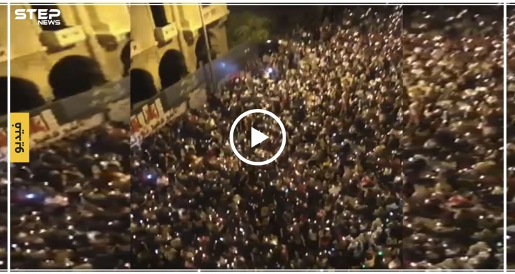 بالشموع والقرع على الطناجر.. هكذا أحيا اللبنانيون ثورتهم في رياض الصلح (فيديو)