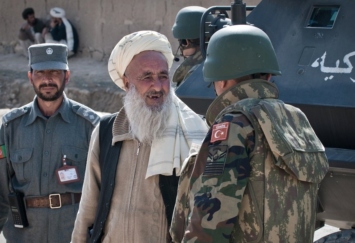 A Turkish Army soldier speaks with a resident in Afghanistan 1