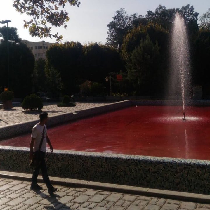 An unknown artist has poured red dye into fountains in Tehran following protests in the city over the last two weeks following the death of MahsaAmi